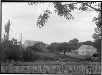 Landscape with stone barn and two-story stone house